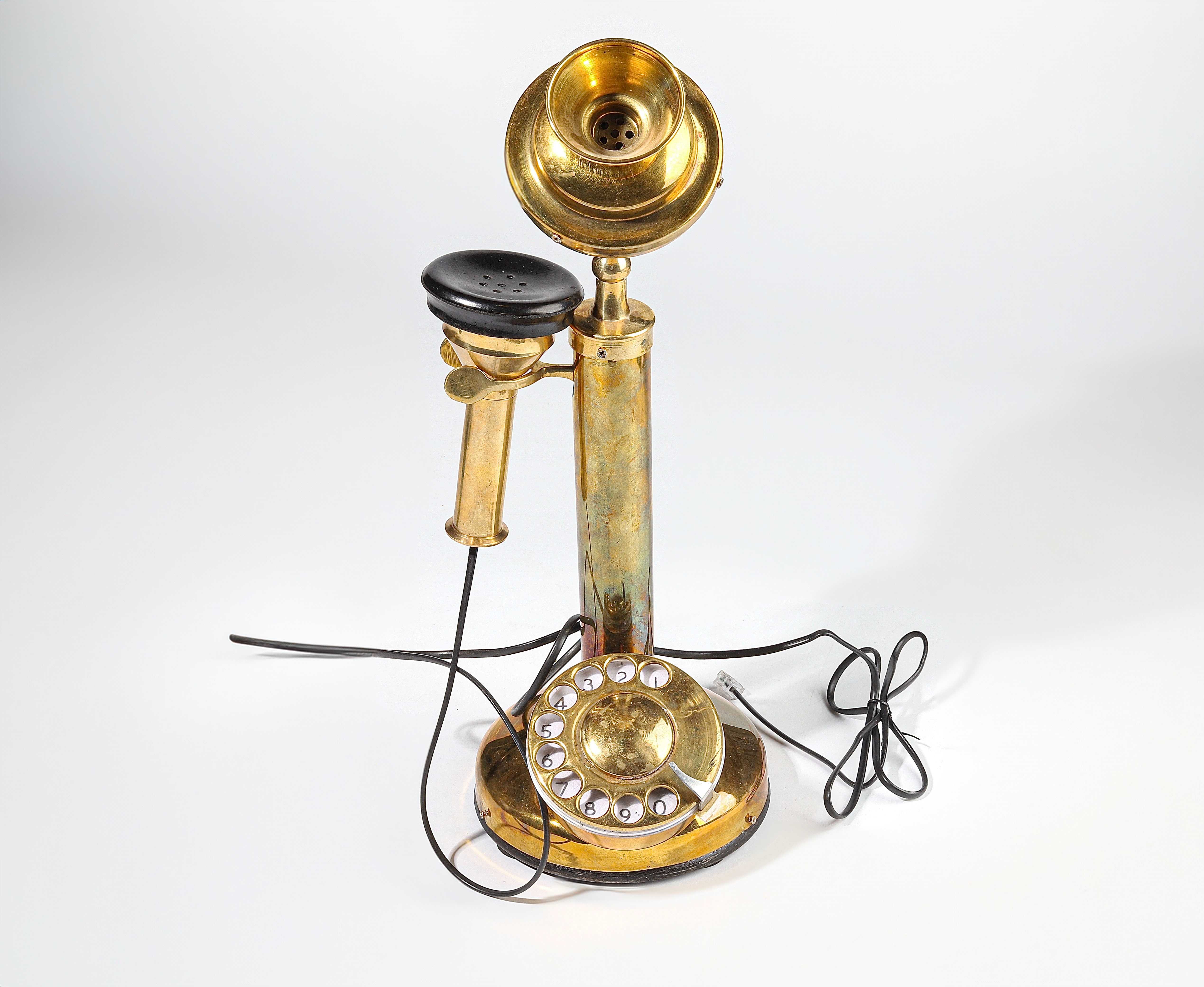 Antique telephones of different shapes and sizes